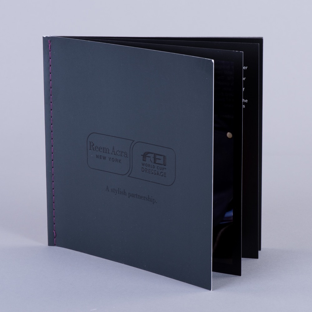 Thread-sewn luxury brochure litho printed UV varnished and embossed for premium events, Create-This Ltd, UK manufactured