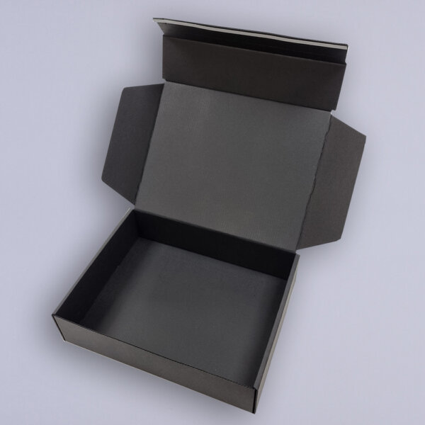 Black corrugated mailing box pizza style black core with optional rip strip and fitment, UK manufactured by Create-This Ltd